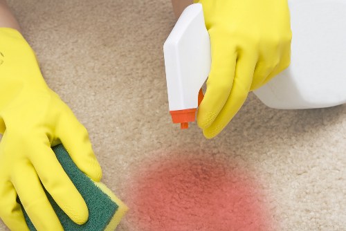 Professional carpet cleaners refreshing a living room carpet in Gipsy Hill